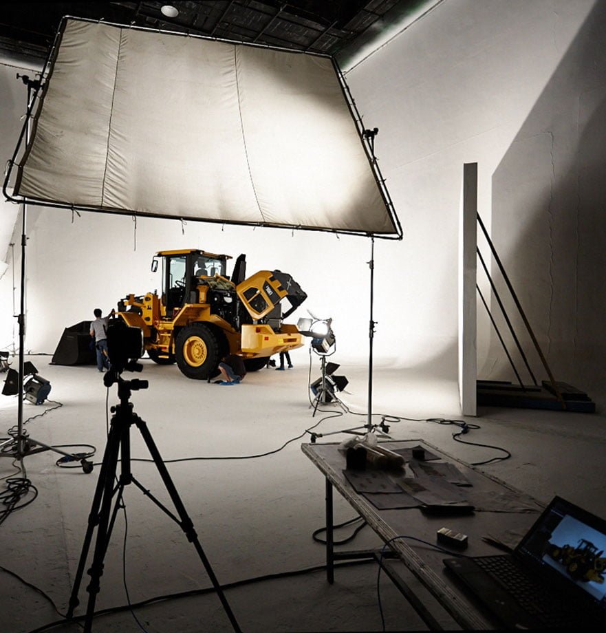 Behind the scenes photo of a Volvo Construction Equipment photo production.